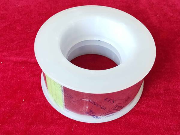 A plastic axle of anti-splash tape on red background.