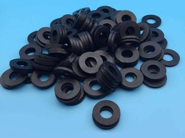 There are many NBR gaskets on the blue background.
