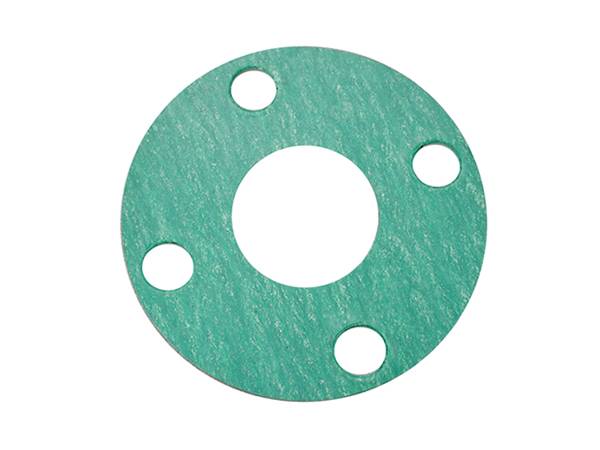 A green non-asbestos gasket on the white background.