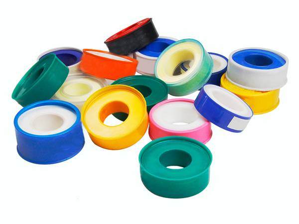 Several different colors of PTFE sealing tapes on white background.